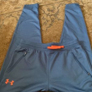Under Armour Dusty blue big boys size XL pants with neon orange accents.